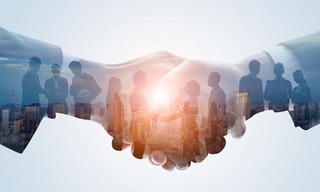 Concept photo of hands holding in business partnership