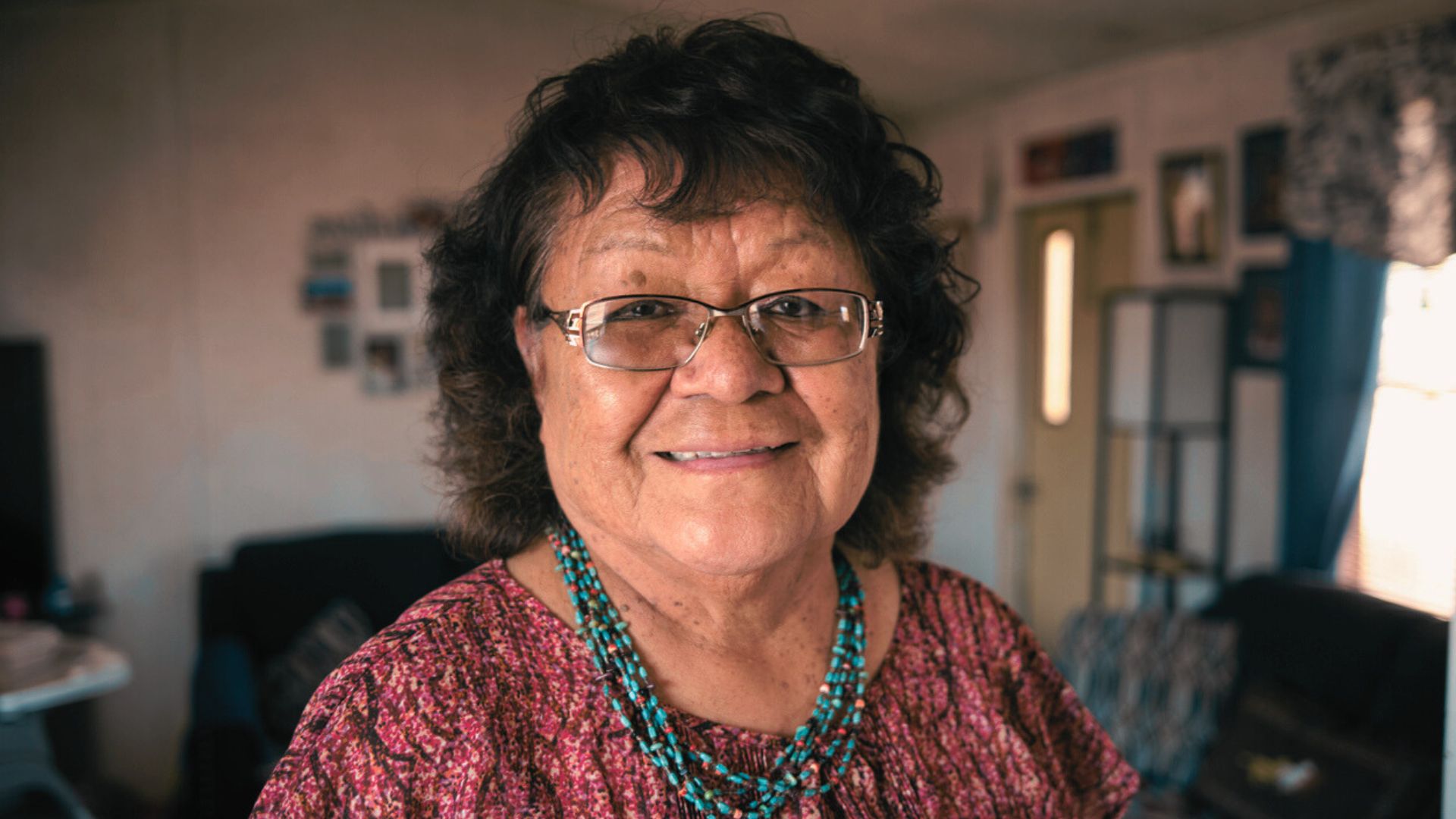 Mature Native American woman smiling at camera