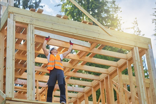Construction worker at work building a home. 