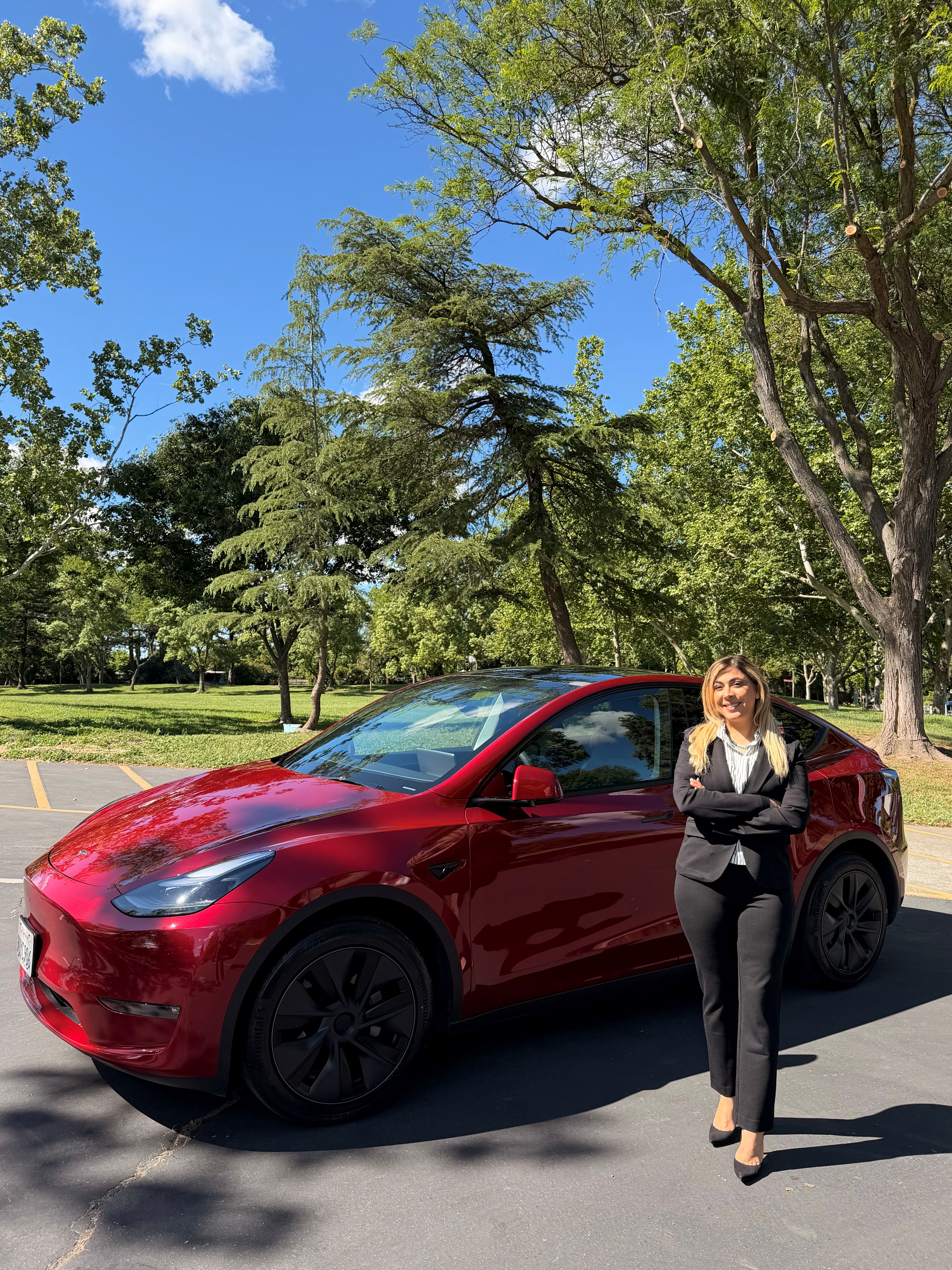Sahba Hafezi next to her Tesla 