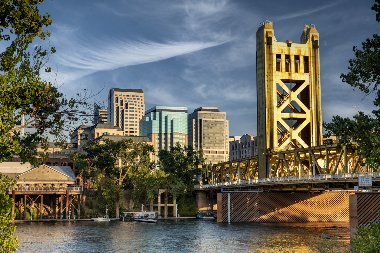 Photo of Sacramento City Capitol Avenue skyline, with Tower Bridge in the front.